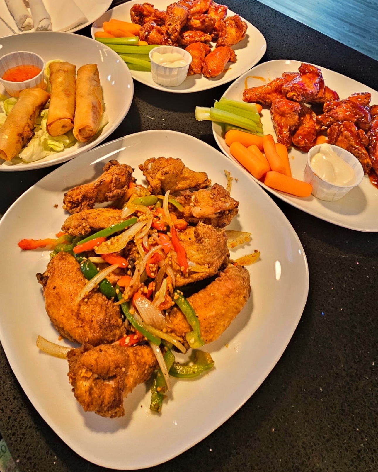Platters of wings, spring rolls and fried chicken from the Boulevard Billiards kitchen
